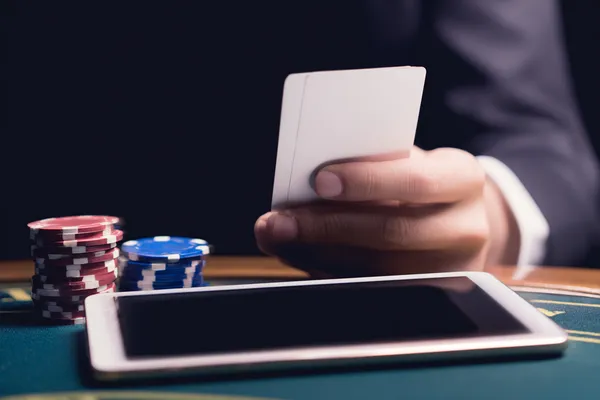 A confident dealer surrounded by casino chips inviting players to access their 456BDBET account, reflecting quick and easy login options.