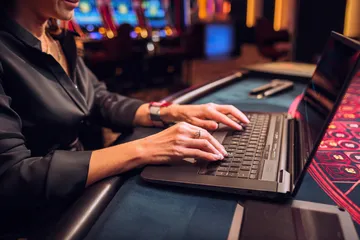 A laptop glowing with a bright login prompt in a minimalistic setup, symbolizing the protected access system at 456BDBET.